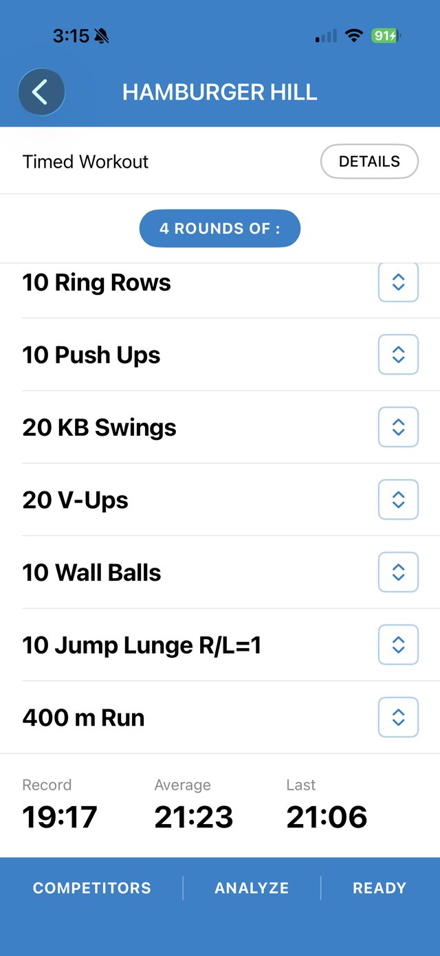 The Phyzseek app showing a PHYZWOD, Hamburger Hill: four rounds of ring rows, push ups, kettlebell swings, V-ups, wall balls, jump lunges and a 400 metre run, with the athlete's record, average and last time.